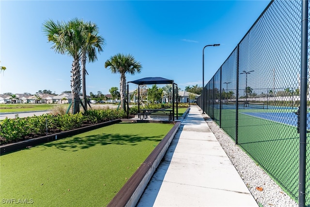 view of community featuring fence