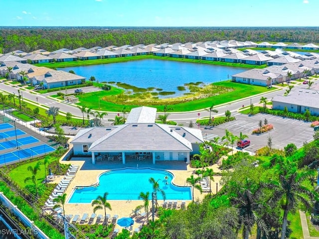 drone / aerial view featuring a residential view and a water view