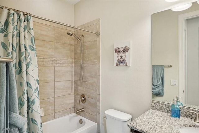 bathroom with shower / tub combo, vanity, and toilet