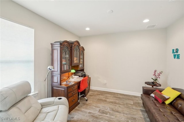 office area featuring recessed lighting, visible vents, baseboards, and wood finished floors
