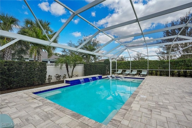 view of pool with a fenced in pool, a lanai, a fenced backyard, and a patio