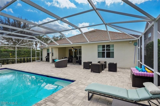 pool with glass enclosure, outdoor lounge area, and a patio