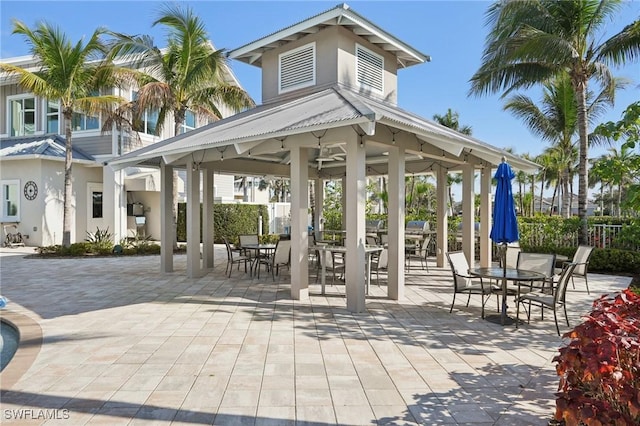 surrounding community with a gazebo, outdoor dining space, and a patio