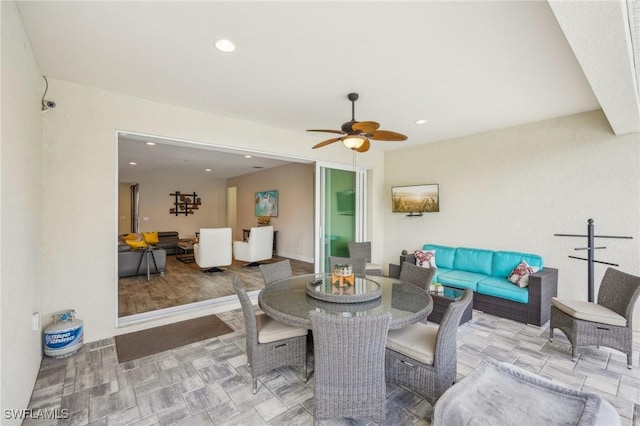 view of patio featuring an outdoor hangout area, outdoor dining area, and a ceiling fan
