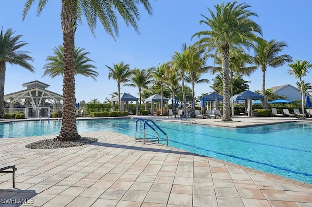 pool featuring a patio and a gazebo