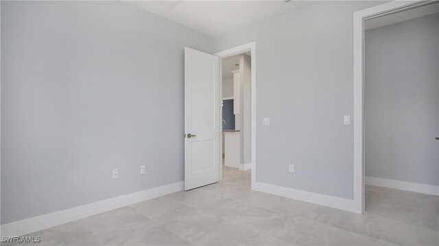 unfurnished bedroom featuring baseboards