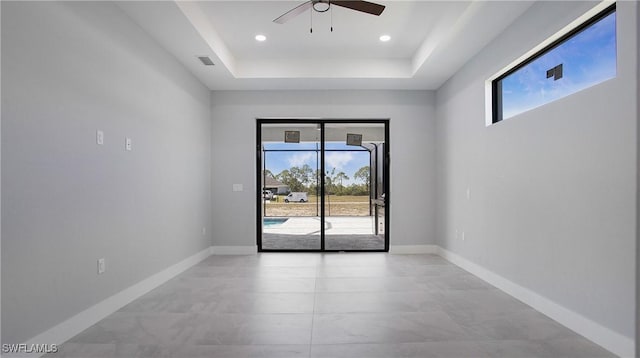 empty room with baseboards, visible vents, ceiling fan, and recessed lighting