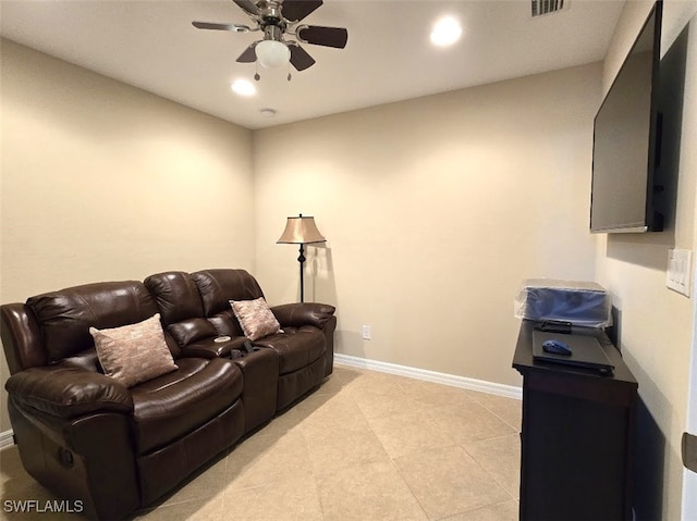 home theater room featuring light tile patterned floors, visible vents, baseboards, ceiling fan, and recessed lighting