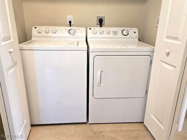 laundry room featuring laundry area and washing machine and clothes dryer