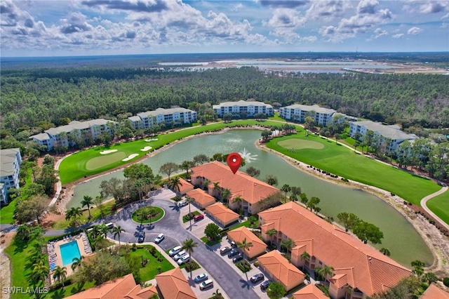 bird's eye view featuring view of golf course, a water view, and a residential view