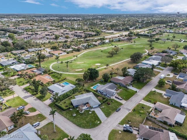 aerial view featuring view of golf course and a residential view