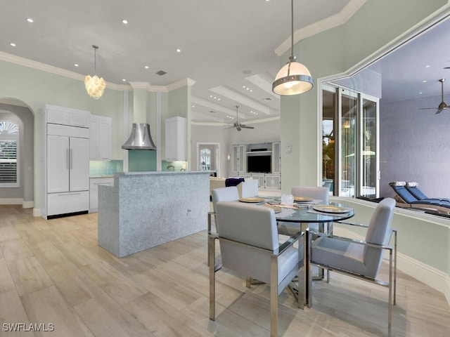7627 Palmer Ct, Naples, FL 34113 - dining area featuring a high ceiling, a ceiling fan, and ornamental molding
