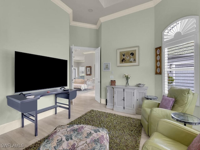 7627 Palmer Ct, Naples, FL 34113 - living area with ornamental molding, light wood-style flooring, a towering ceiling, and baseboards