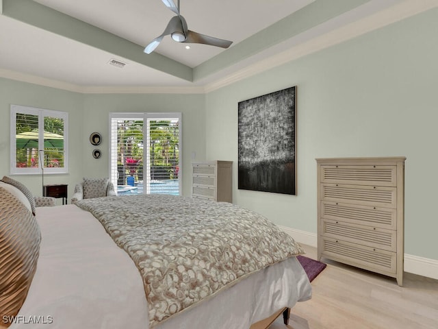 7627 Palmer Ct, Naples, FL 34113 - bedroom with crown molding, visible vents, baseboards, and light wood-style floors