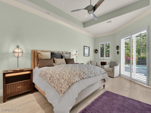 7627 Palmer Ct, Naples, FL 34113 - bedroom featuring crown molding, visible vents, a tray ceiling, access to exterior, and light wood finished floors
