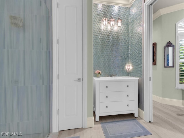 7627 Palmer Ct, Naples, FL 34113 - full bath featuring a tile shower, crown molding, wood finished floors, and baseboards