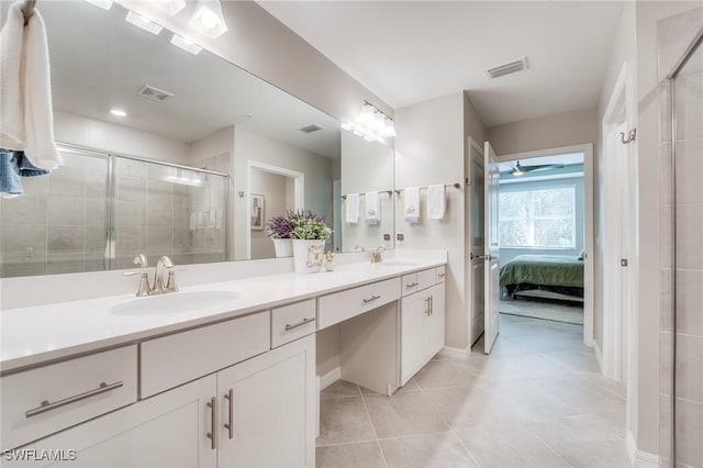 ensuite bathroom featuring double vanity, ensuite bath, a sink, and visible vents