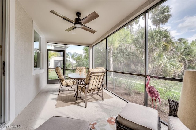 sunroom / solarium with ceiling fan