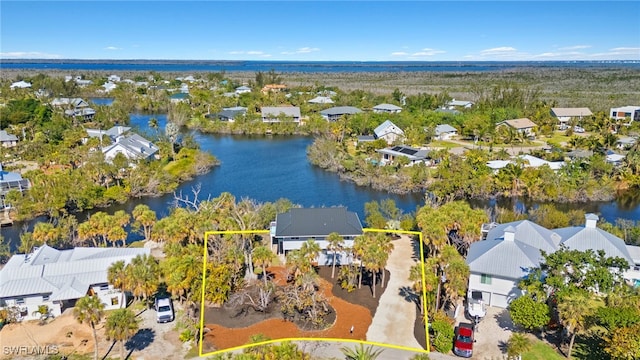 aerial view featuring a residential view and a water view