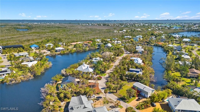 bird's eye view featuring a residential view and a water view