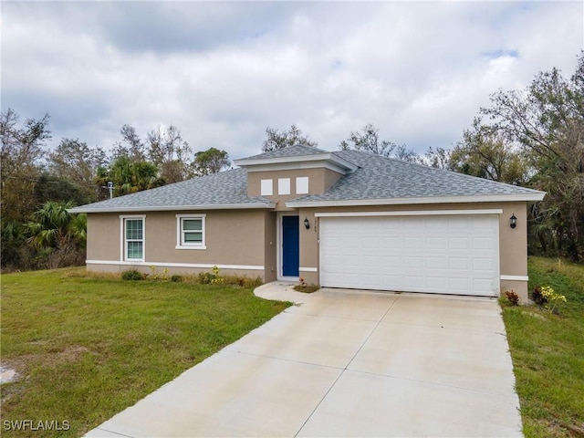 view of front facade with a garage, driveway, a front lawn, and stucco siding