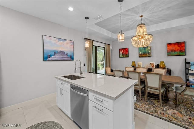 kitchen with dishwasher, a kitchen island with sink, light countertops, white cabinetry, and a sink