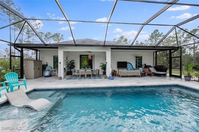 back of house featuring a ceiling fan, a patio, glass enclosure, an outdoor hangout area, and stucco siding