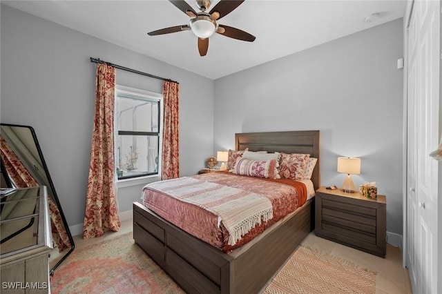 bedroom featuring ceiling fan and baseboards