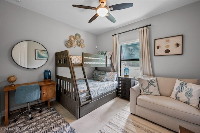 bedroom with ceiling fan and light tile patterned floors