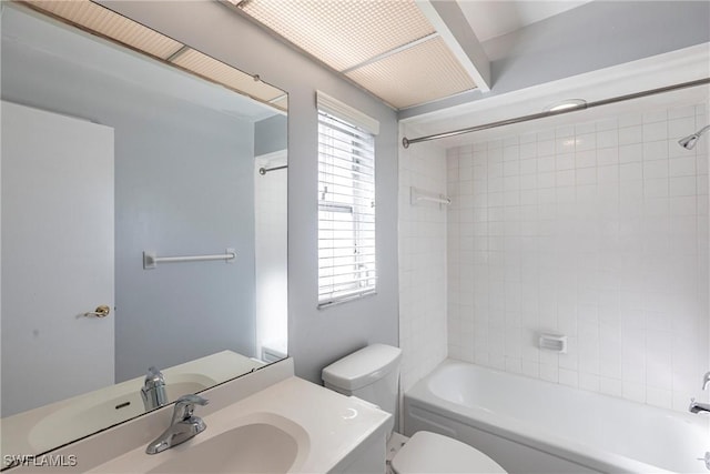 bathroom with toilet, washtub / shower combination, and vanity