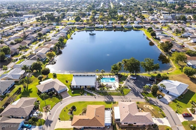 birds eye view of property with a residential view and a water view