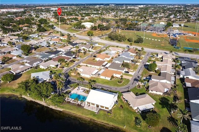 bird's eye view featuring a water view and a residential view