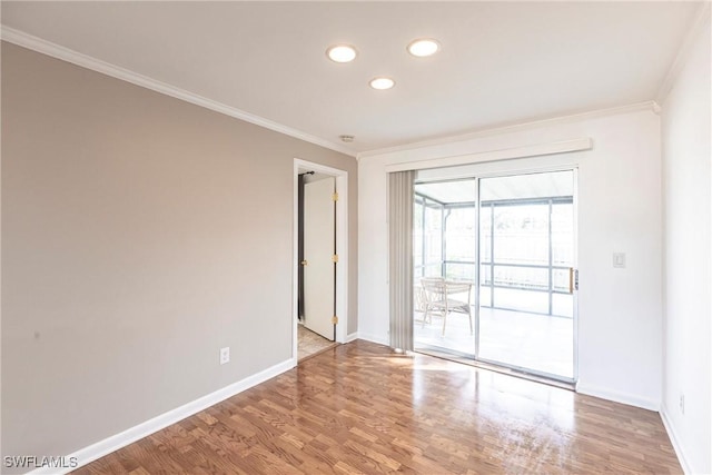 empty room with ornamental molding, recessed lighting, baseboards, and wood finished floors