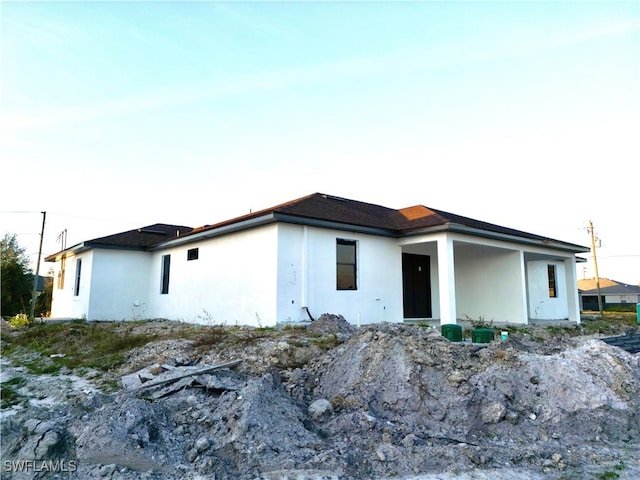 view of front of house featuring stucco siding