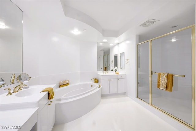 full bathroom featuring a bath, a stall shower, visible vents, and a sink