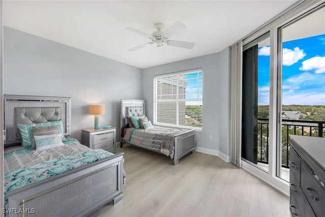 bedroom featuring baseboards, ceiling fan, light wood-style floors, and access to exterior