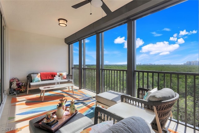 sunroom featuring ceiling fan