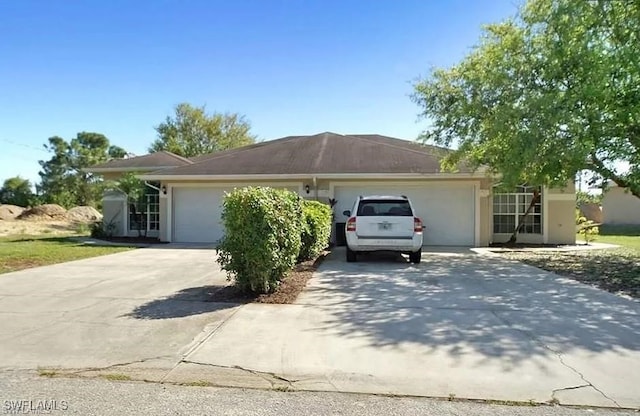 view of home's exterior with a garage and driveway