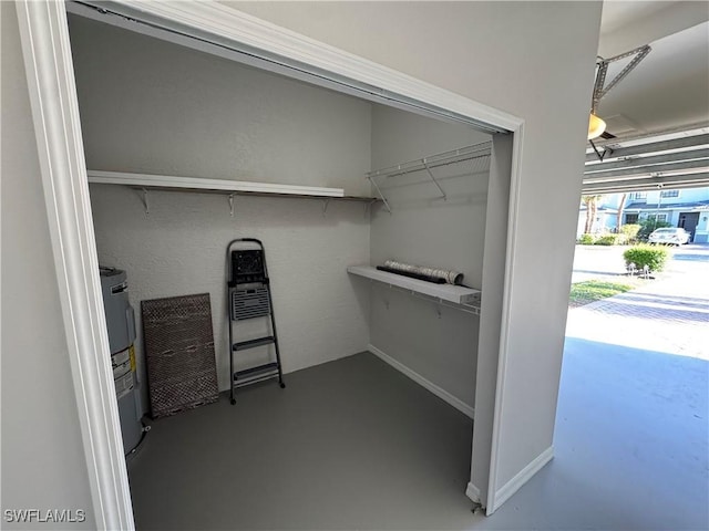 spacious closet featuring water heater