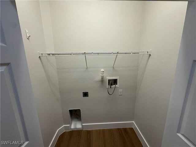 clothes washing area with washer hookup, dark wood finished floors, electric dryer hookup, laundry area, and baseboards