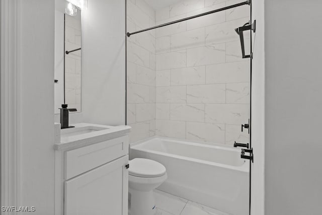 bathroom featuring marble finish floor, bathing tub / shower combination, vanity, and toilet