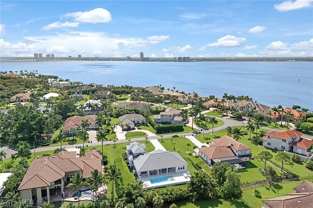 birds eye view of property featuring a water view and a residential view