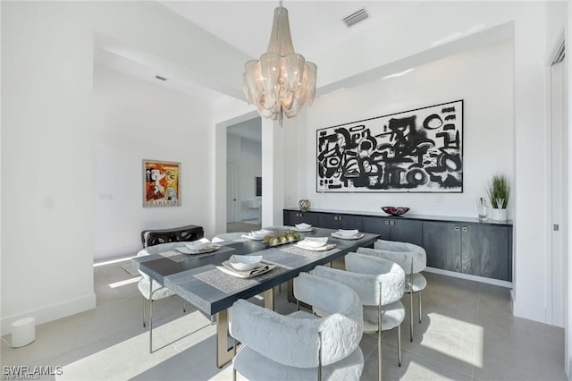 dining area with baseboards, light tile patterned flooring, visible vents, and an inviting chandelier