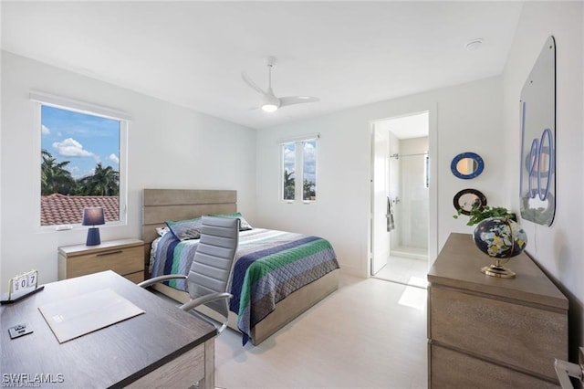 bedroom featuring ceiling fan and ensuite bathroom