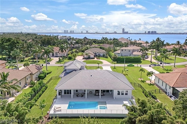 birds eye view of property featuring a residential view and a water view