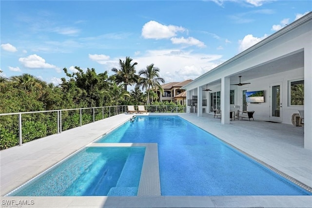 view of swimming pool featuring a patio, a ceiling fan, and a fenced in pool