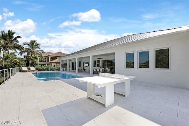 view of pool featuring ceiling fan, a patio area, and a fenced in pool