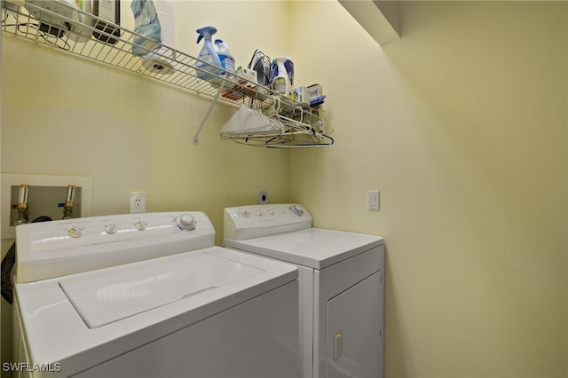 washroom with laundry area and separate washer and dryer