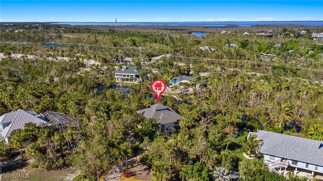 bird's eye view featuring a wooded view