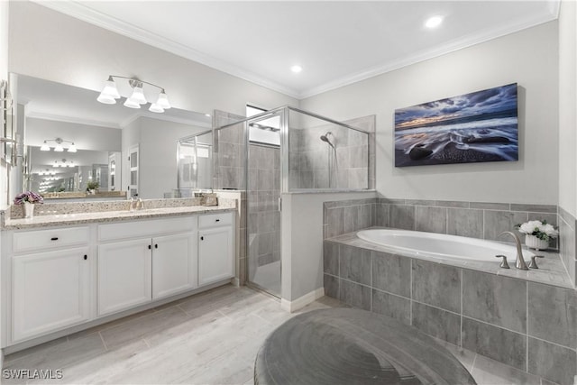 full bathroom with a garden tub, a shower stall, crown molding, and vanity